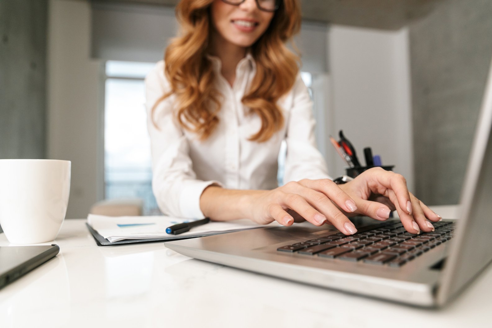 Woman Typing on her Laptop 