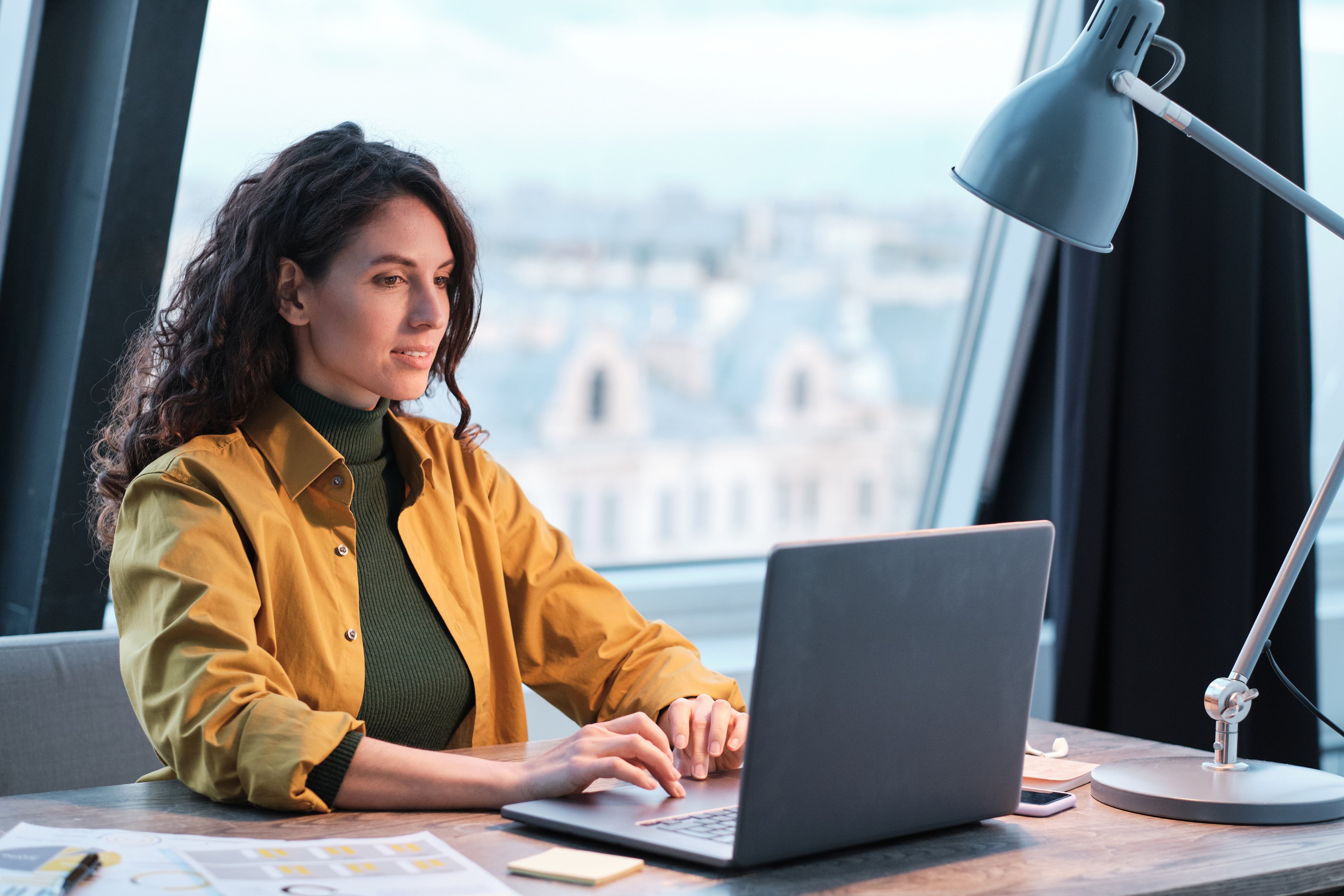 Woman Typing on Computer at Office