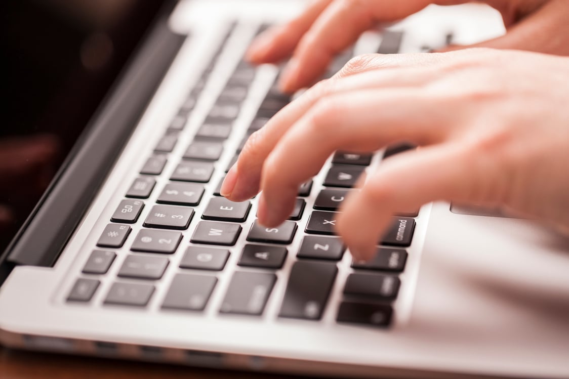 Female hands working on data entry with keyboard